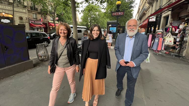  Vice Principal Ingvild M. Larsen, student chairperson Nora R. Houidi and Rector Petter Aasen are walking alongside eachother on a street in Paris