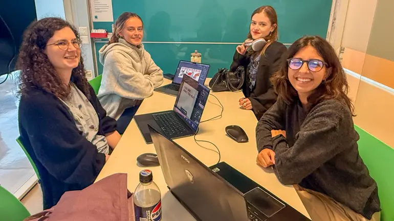 Four design-students at a table